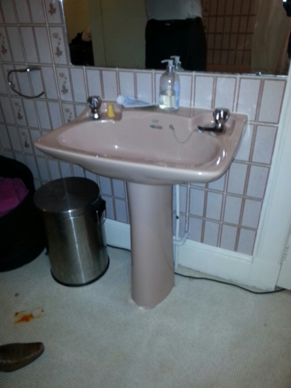 Old pink wash hand basin